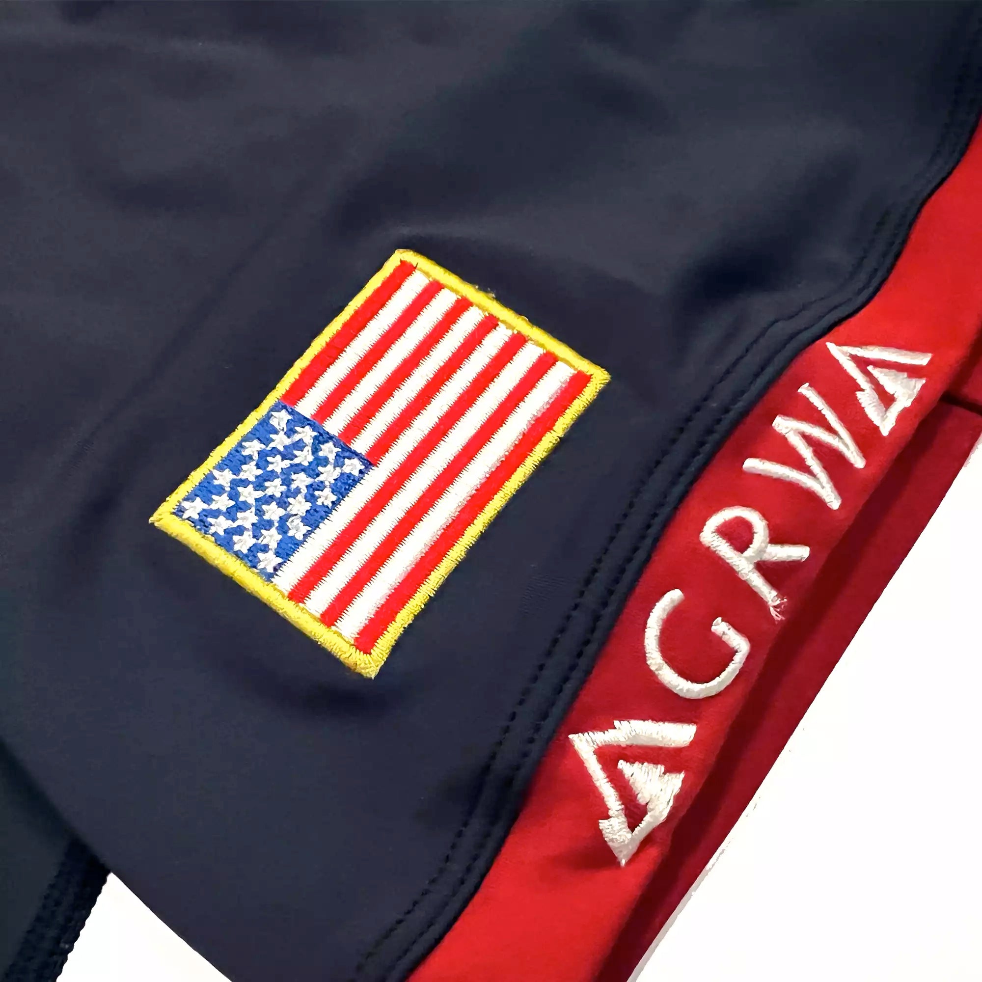 GRW women's American Jiu-Jitsu BJJ Rash Guard american flag patch close up